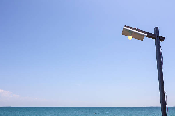blue sky, sea and street lights