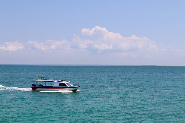 Preparation of parasailing boat for the tourists at Gerakini beach. Halkidiki, Greece, Europe.