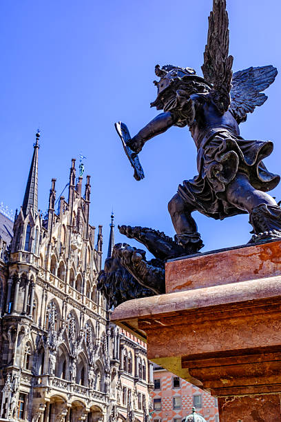Golden statue of Holly Mary on a column in the centre of Marienplatz, Munich, Germany