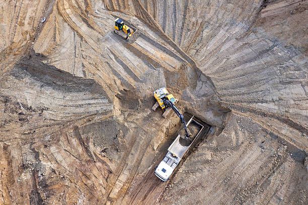 istock aerial view of quarry. excavator loading sand into dump truck 2228150161