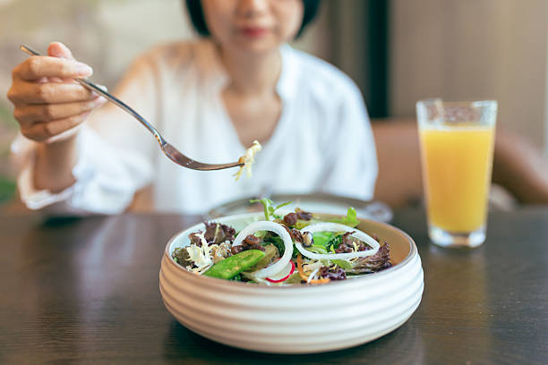 istock An Asian woman dining in a restaurant 2228153952