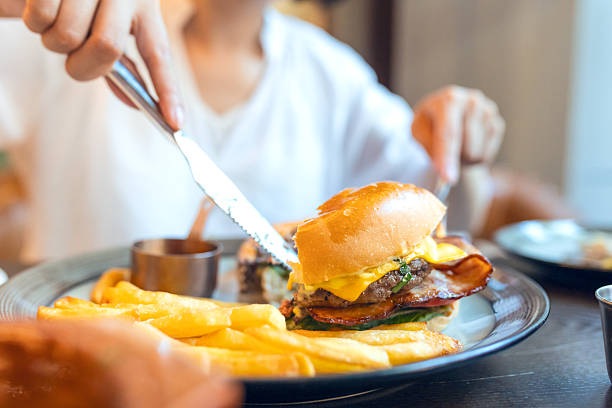 istock An Asian woman dining in a restaurant 2228155575
