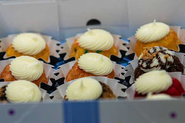 istock Assorted Mini Bundt Cakes with Frosting in Bakery Box 2228155775