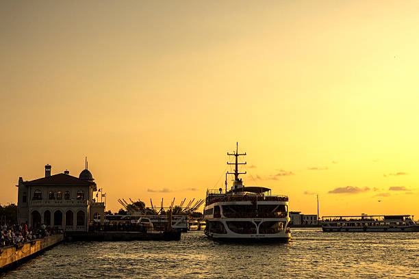 Istanbul, Turkey : July 30, 2025: Tourist boat on the Bosphorus of the Istanbul, Turkey, Kadikoy Harbour