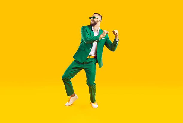istock Cheerful and stylish young man is having fun dancing at St. Patrick's Day party. 2228160253