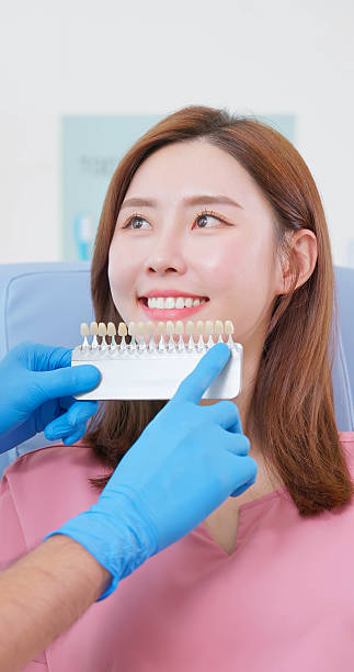 istock dentist use shade comparison choosing teeth color 2228160360
