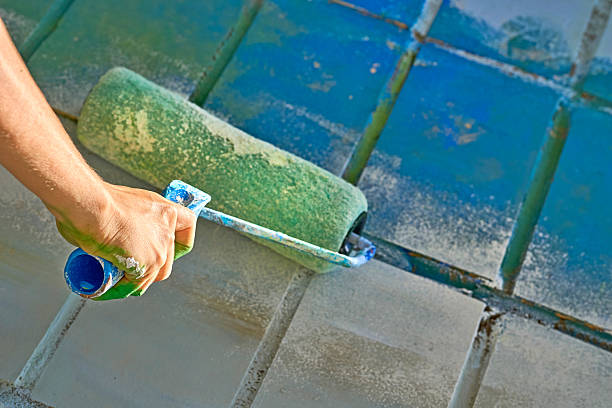 istock Repairing.Roller painting wall surface with blue paint 2228165436