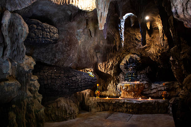 istock Buddha meditation protect cover head by mythical serpent or Naka Prok Buddha Sheltered in Naga Cave Tham Nakee for thai people travel visit respect praying at Wat Khae Temple in Suphan Buri, Thailand 2228165657