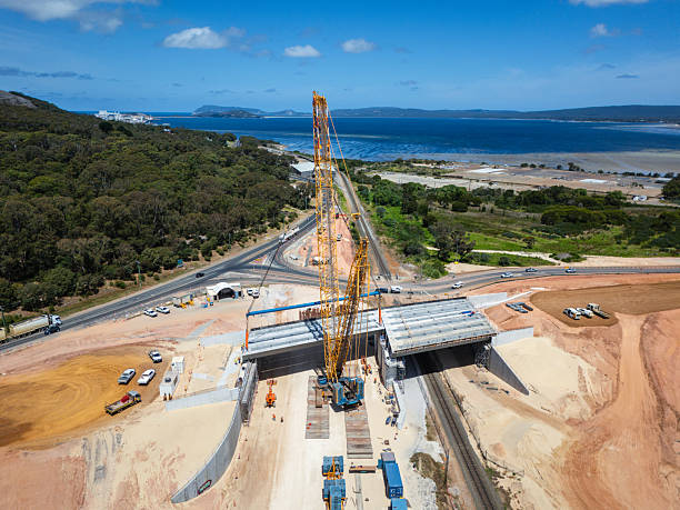 istock Large Construction Site With Road Bridge Over Railroad by the Seaside 2228167842