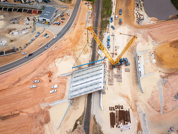 istock Aerial View of Bridge Construction With Crane and Infrastructure Development 2228167924