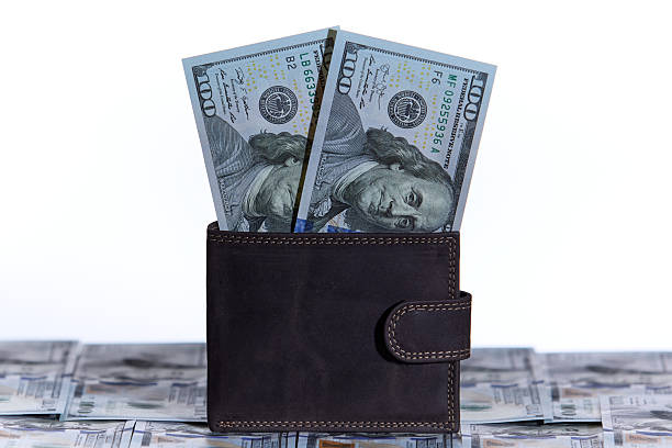 istock Crisp US bills in leather wallet, vertical shot 2228170649