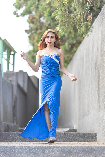 istock Glamorous Woman in Blue Evening Gown 2228172718
