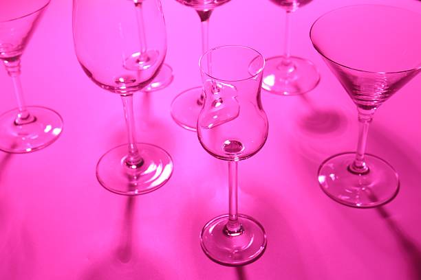istock Empty glasses on pink background, closeup. Color tone effect 2228176592