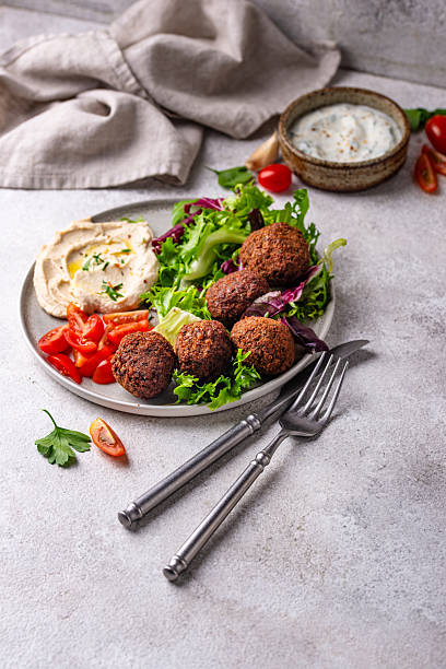 istock Salad with hummus, falafel and vegetables 2228177971