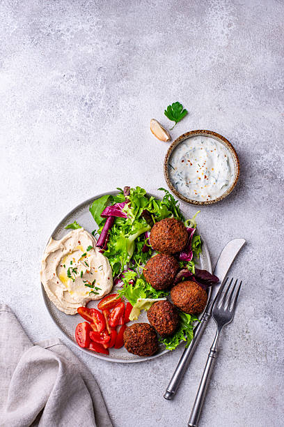istock Salad with hummus, falafel and vegetables 2228178118