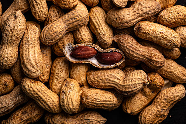 istock Pile of peanuts with one opened pod 2228178195
