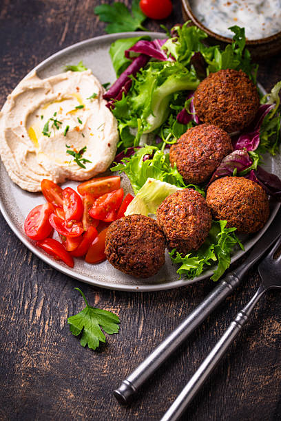 istock Salad with hummus, falafel and vegetables 2228178291