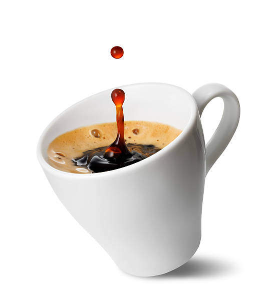 istock Small inclined espresso cup with freshly brewed coffee with splash and drop, isolated on white background 2228178378