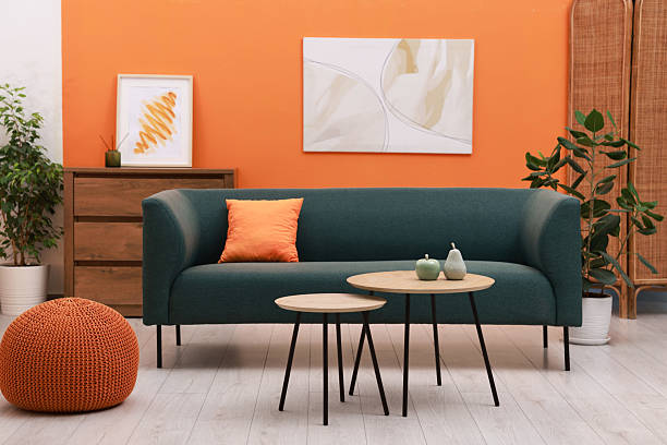 istock Stylish living room interior with sofa and nesting tables 2228178605