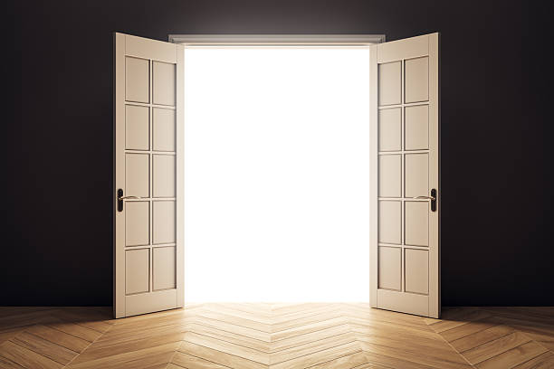 istock Open double doors with bright white light shining through, symbolizing opportunity, hope, or transition in a modern interior space. 3D Rendering 2228184144