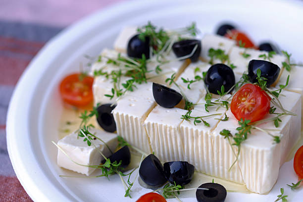 istock Feta cheese with olives, tomatoes and microgreens. 2228185358