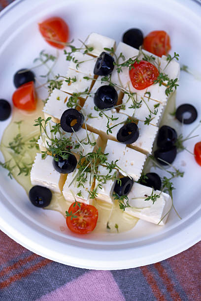 istock Feta cheese with olives, tomatoes and microgreens. 2228185360