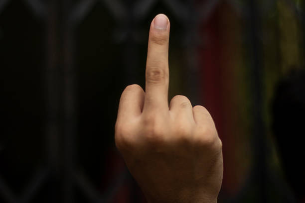 A man pointing one finger of his hand forward and blurred background