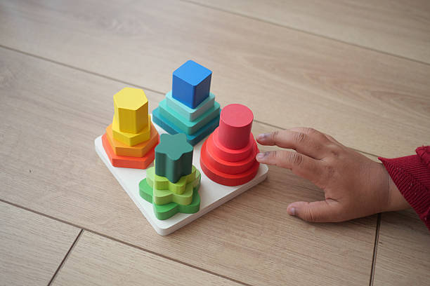 istock Colorful stacking toys engaging a young child's interest indoors 2228189944