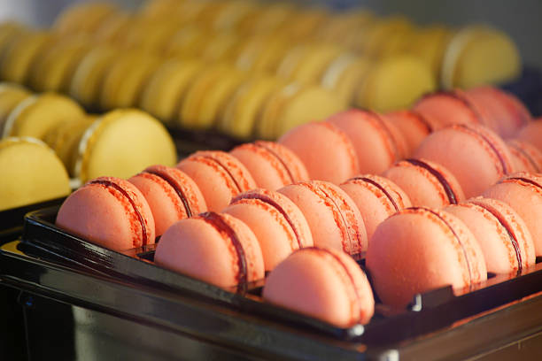istock Colorful macarons displayed in a pastry shop on a sunny day 2228191104