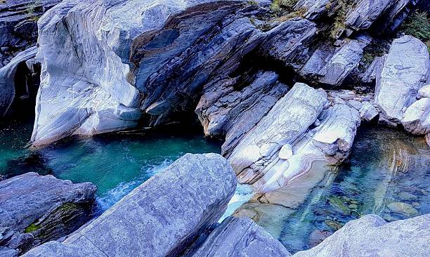 istock Dramatic steep rock formations at the Verzasca River with clear turquoise water in Ticino, Switzerland 2228191615