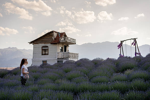 Mature woman spending time in lavender garden.