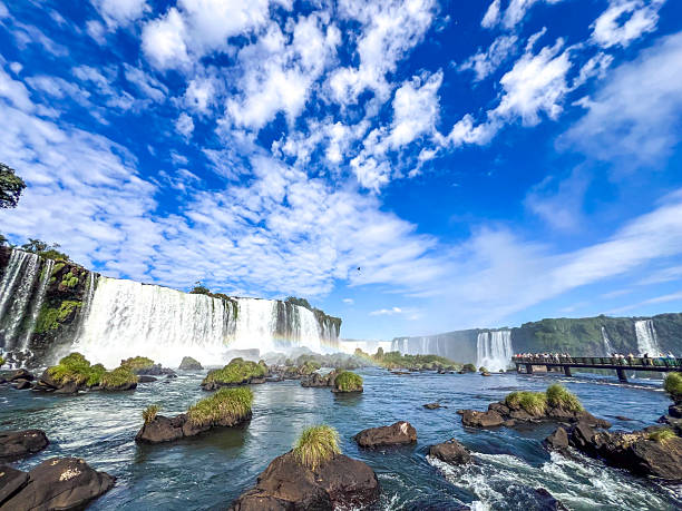 istock RAINBOW OVER IGUAZU FALLS WITH TOURISTS ON VIEWING PLATFORM  BRAZIL 2228195939
