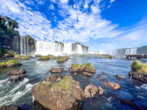 istock RAINBOW OVER IGUAZU FALLS WITH TOURISTS ON VIEWING PLATFORM  BRAZIL 2228196218
