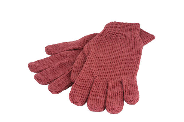 istock Woolen pink gloves isolated on a white background. Female accessory. 2228197333