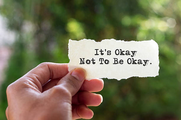 istock Torn paper with quotes it's okay not to be okay 2228200218