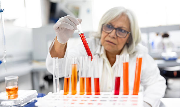 istock Doctor holding a test tube at the laboratory while doing medical tests 2228200332