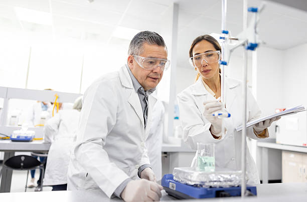 istock Scientific researchers performing an experiment at the laboratory 2228200400