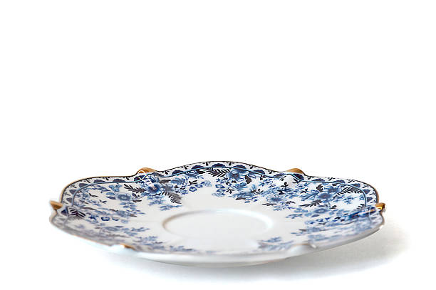 istock The porcelain saucer is isolated on a white background 2228203767