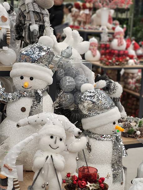 istock Christmas snowman toys with silver hats 2228204878