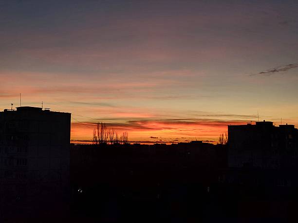 istock Sunset over city skyline with vivid colors 2228205589