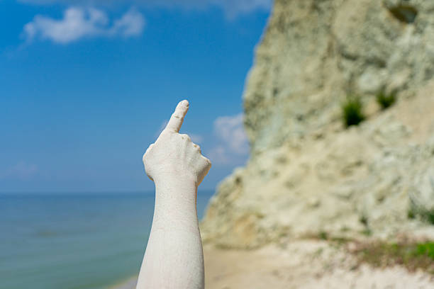 Detail of person stacking rocks by the lake, shot in Ticino Canton, Switzerland.People life balance concept