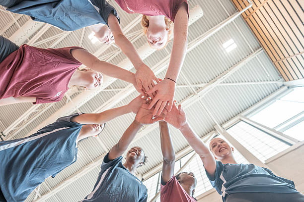 istock Team Supporting Each Other with Hands Joined in a Sports Hall 2228205815