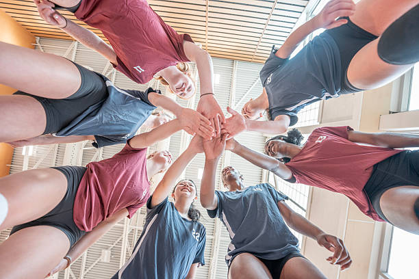 istock Diverse Volleyball Team Sharing a Motivational Circle Before Practice in a Gymnasium 2228205834