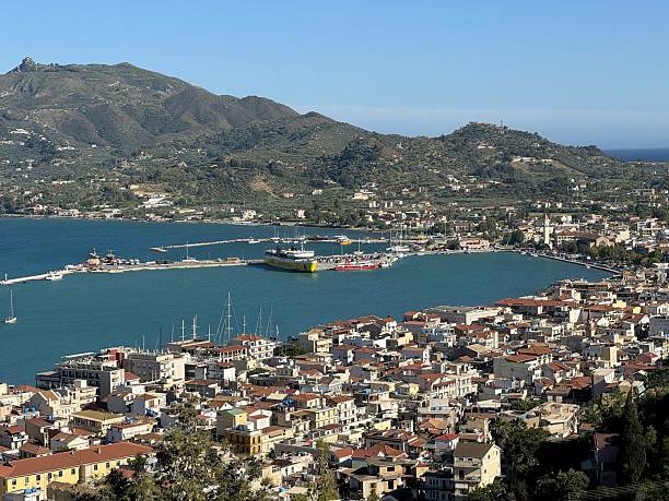 Zakynthos, Greece - June 14, 2024: Panoramic view of the bay with visible boats and vessels and the city of Zakynthos on Zakynthos Island in Greece.