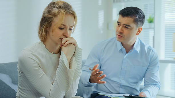 istock Therapist comforting patient during emotional therapy session. 2228211100