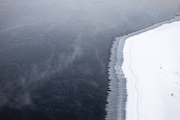 istock Frozen River and Snowy Winter Landscape 2228214269