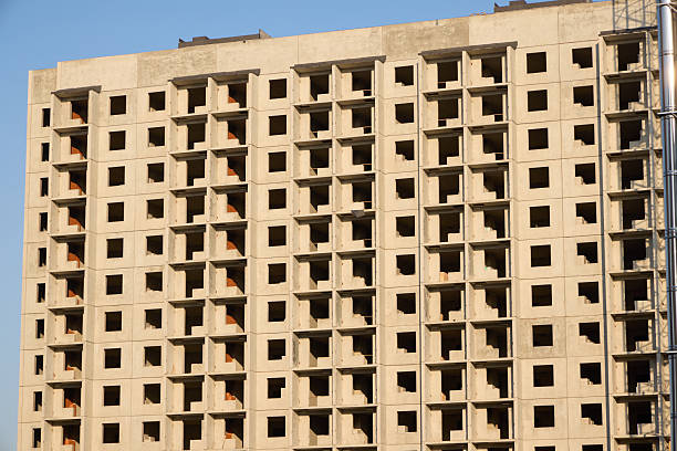 istock A Modern Building is Under Construction featuring Open Windows and an Exposed Concrete Structure 2228214557