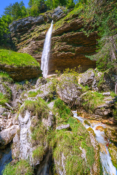 istock View from down to the Waterfall Pericnik in Slovenia. 2228219762