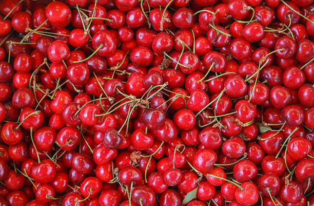 istock Fresh Red Cherries with Stems at a Market 2228230805