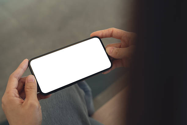 istock Close up, smartphone blank screen mockup. Woman hand holding, using mobile phone with blank white screen mockup for social media marketing, horizontal 2228233287